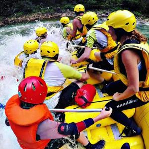 a group of people rafting on a river at Log cabin 2 Merdovic in Mojkovac