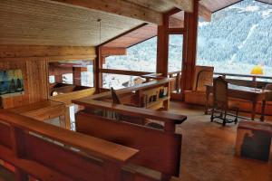 a room with a church with a view of a mountain at Chalet Morgane in Grindelwald +10 photos