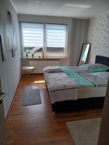 Postel nebo postele na pokoji v ubytování Fewo schöne Aussicht