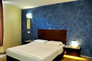 Katil atau katil-katil dalam bilik di AVARIA BOUTIQUE HOTEL