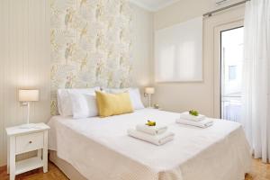 Posteľ alebo postele v izbe v ubytovaní Ivory Luxury Suite by CorfuEscapes