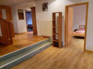 a room with a stairway leading to a bedroom at Ferienwohnung in Xanten auf dem Moerenhof in Xanten