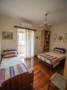 Ένα ή περισσότερα κρεβάτια σε δωμάτιο στο Villa Haris