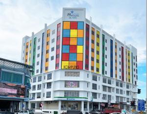 a large building with colored squares on it at Sri Indar Hotel & Suites in Parit Buntar