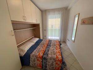 Postel nebo postele na pokoji v ubytování Residence Gianka - Agenzia Cocal