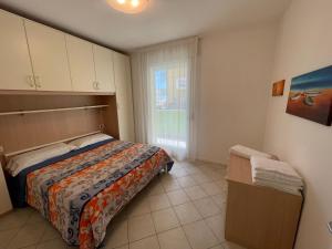 Postel nebo postele na pokoji v ubytování Residence Gianka - Agenzia Cocal