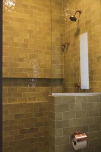 a bathroom with a shower with a toilet in it at Øko Villa in Juquei +156 photos