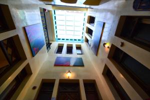 an overhead view of a room with a large window at Riad Assilah in Asilah
