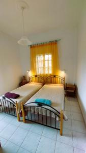 Postel nebo postele na pokoji v ubytování Sausan Apartments