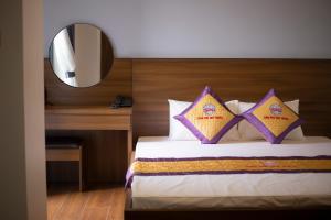 Säng eller sängar i ett rum på Khách sạn Sớm Phú Quý - Ninh Thuận
