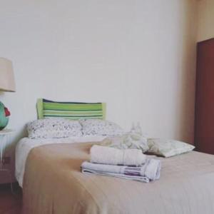 Postel nebo postele na pokoji v ubytování LaCasaDelleCoseBelle B&B Reggio Emilia + 23 fotografií
