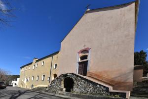 a large building with a window on the side of it at GITE DES MOINES-Canelle in Canari