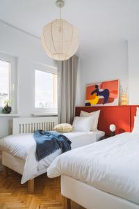 מיטה או מיטות בחדר ב-Warsaw Concierge Eclectic Design