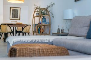 a living room with a couch and a table at Apartment Nobilis in Zambratija