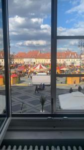 a view of a city from a window at ELISABETH HOME Piata Mare in Sibiu