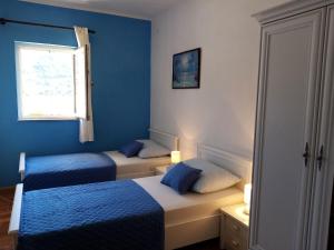 Postel nebo postele na pokoji v ubytování Apartments Dalmatia
