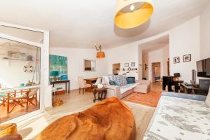 a living room with a couch and a table at Church Square Apartment in Praia da Luz in Luz
