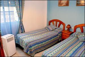 Postel nebo postele na pokoji v ubytování Apartamento El Carmen