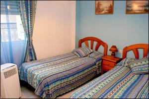 Postel nebo postele na pokoji v ubytování Apartamento El Carmen