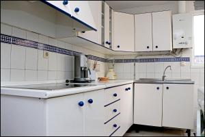 Kuchyň nebo kuchyňský kout v ubytování Apartamento El Carmen + 14 fotografií