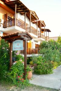 a sign in front of a building with a balcony at Kastalia in Ammouliani