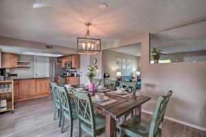 a dining room and kitchen with a table and chairs at Phoenix Family Home with Pool and Playground! in Phoenix
