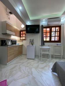 a kitchen with a large marble floor at Ano Poli Studios 4 in Thessaloniki