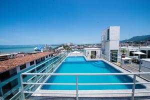 a swimming pool on the roof of a building at Hotel Portonovo Plaza Malecon in Puerto Vallarta