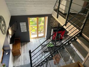 an overhead view of a staircase in a building at Duplex avec poêle à granulés et garage à motos in Montaigut-le-Blanc