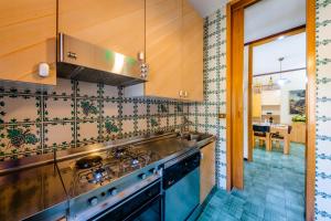 a kitchen with a sink and a stove at Domus Auditorium in Ravello