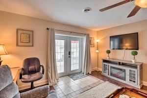 a living room with a fireplace and a tv at Bristol Escape with Patio, 2 Mi to Downtown! in Bristol