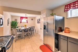 a kitchen and dining room with a stainless steel refrigerator at Bristol Escape with Patio, 2 Mi to Downtown! in Bristol