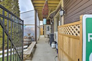 a porch of a house with a wooden fence at Dtwn Sheboygan Apt Above Local Bar! in Sheboygan