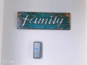 a sign that says family next to a remote control at Penghu Little Apple II in T'ien-hsiang