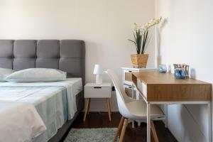 Posteľ alebo postele v izbe v ubytovaní Penthouse Gea