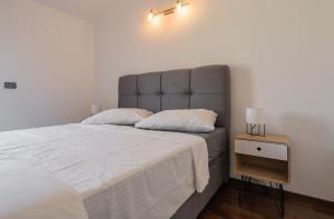 Posteľ alebo postele v izbe v ubytovaní Penthouse Gea