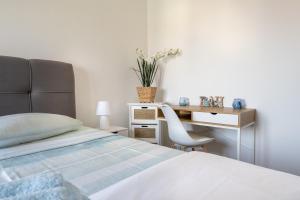 Posteľ alebo postele v izbe v ubytovaní Penthouse Gea