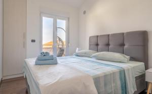 Posteľ alebo postele v izbe v ubytovaní Penthouse Gea