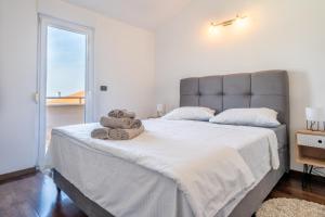 Posteľ alebo postele v izbe v ubytovaní Penthouse Gea
