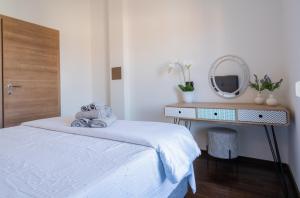 Posteľ alebo postele v izbe v ubytovaní Penthouse Gea