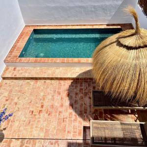 a swimming pool with a broom on top of it at Alvor Bela Vista II in Alvor