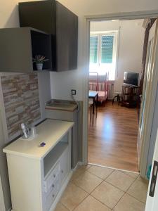 Kuchyň nebo kuchyňský kout v ubytování B&B Rialto