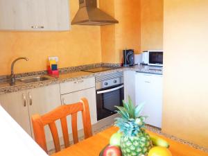 A kitchen or kitchenette at Apartamentos Cala Llonga