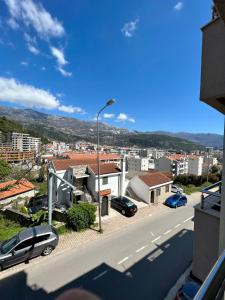 a view of a city with cars parked on a street at Guest House Mrvaljević in Budva