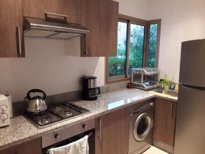 Een keuken of kitchenette bij Appartement résidentiel Prestigia