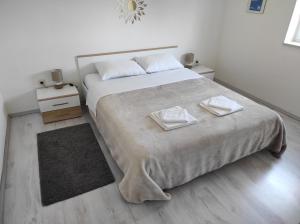 Postel nebo postele na pokoji v ubytování Apartman Eli 2
