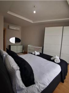 a bedroom with a large bed with towels on it at Garden Grandresidence in Basaksehir