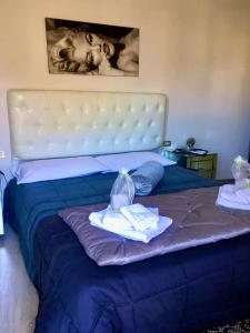 Postel nebo postele na pokoji v ubytování Casa Laura Viareggio