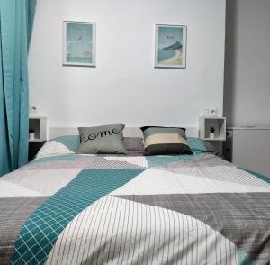 Posteľ alebo postele v izbe v ubytovaní Aqua Apartment