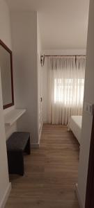 Postel nebo postele na pokoji v ubytování Hostal Linar